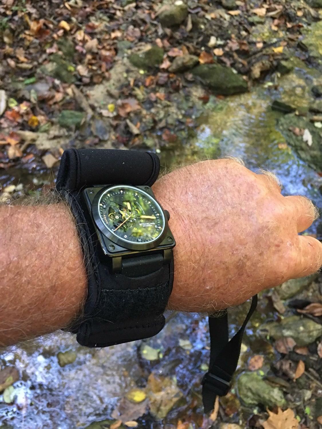 Black WATCH-ET by the creek