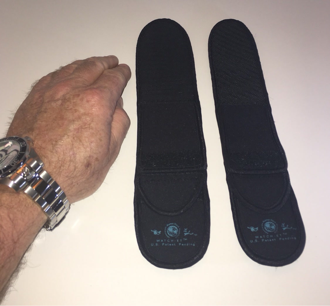 Two Night OP's Black WATCH-ET sleeves beside a wristwatch