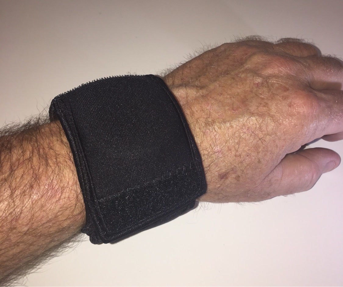 Night OP's Black WATCH-ET on the wrist, cover flap closed