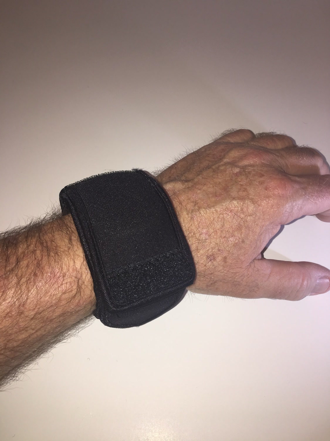 Night OP's Black WATCH-ET worn with a closed fist