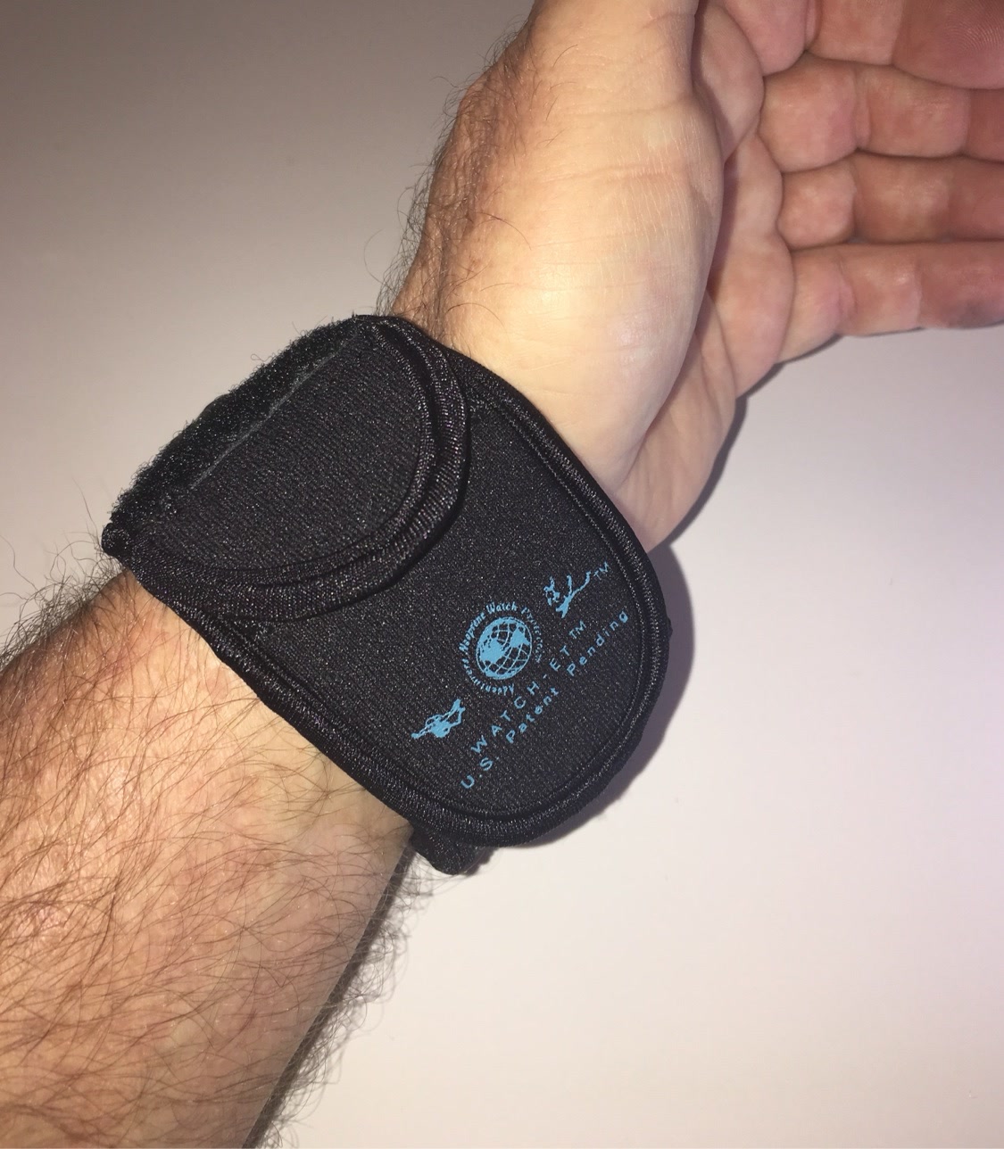 Night OP's Black WATCH-ET showing the logo print on the cover flap