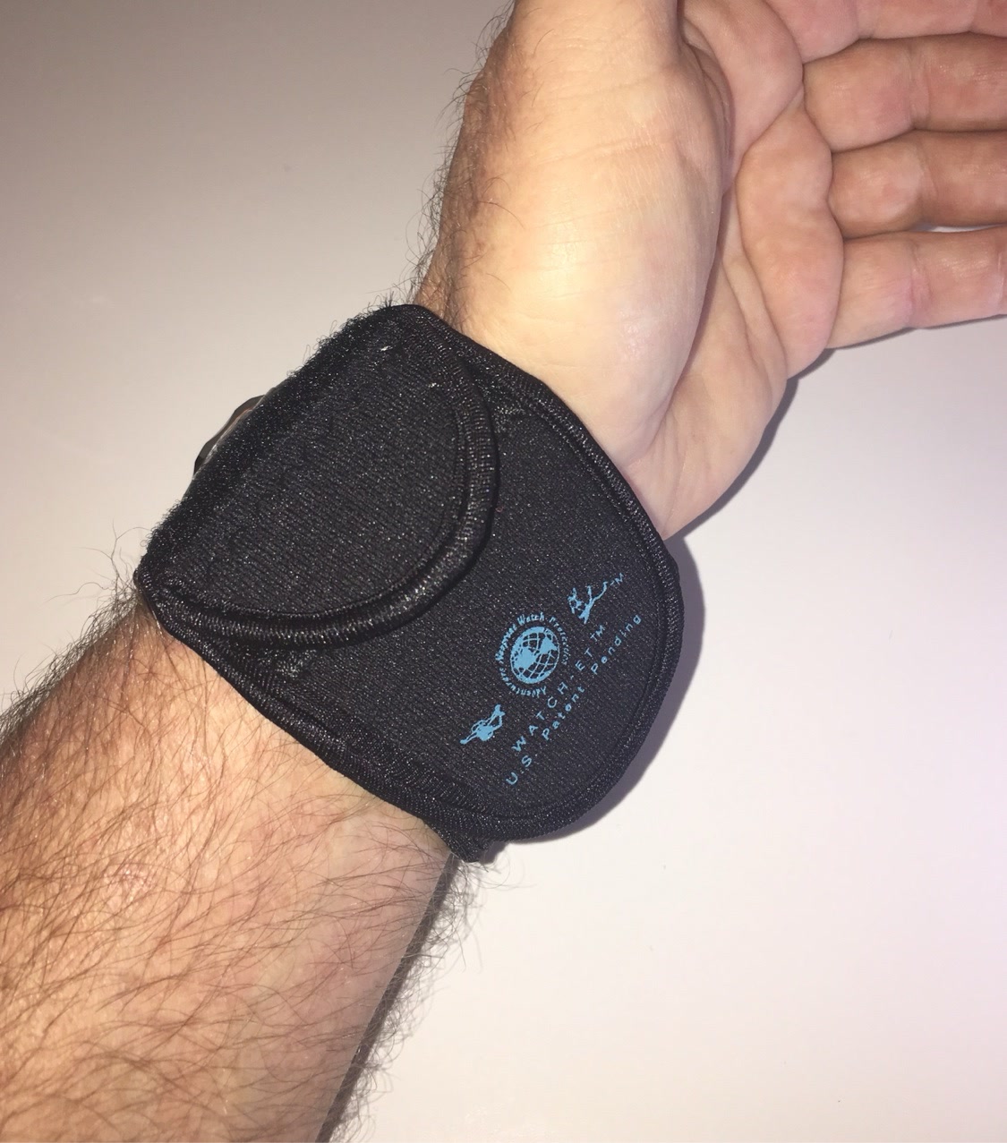 Night OP's Black WATCH-ET, palm-side view with logo print