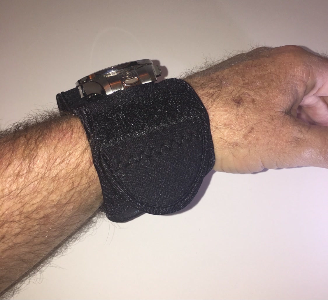 Night OP's Black WATCH-ET, side view with the watch peeking above the sleeve