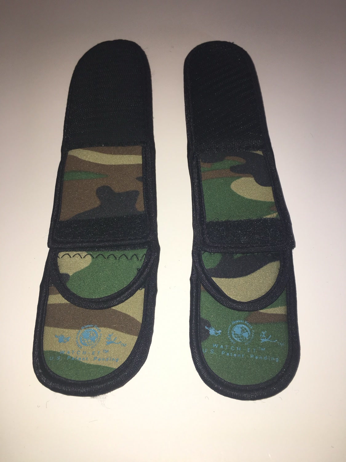 Two Camo WATCH-ET sleeves laid flat